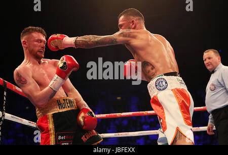 James Tennyson (left) and Ryan Doyle during their WBA International Super-Featherweight Championship at Odyssey Arena Belfast. Stock Photo