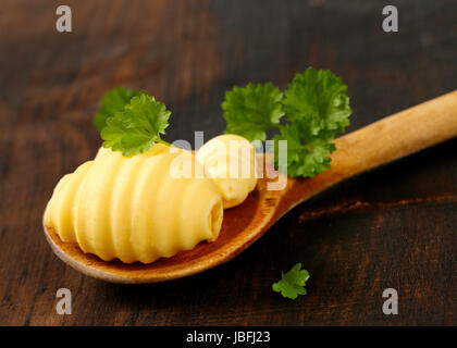 Butter curls on wooden spoon Stock Photo