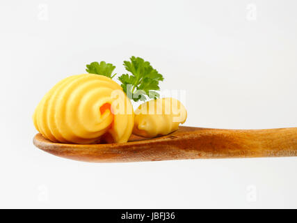 Butter curls on wooden spoon Stock Photo