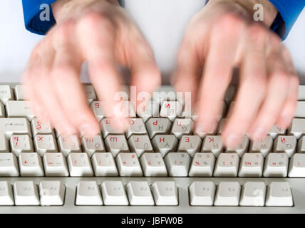 Fingers type a text on the computer keyboard Stock Photo