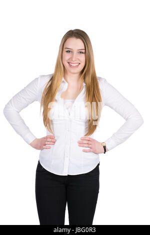 Freigestelltes Foto einer jungen lächelden Frau, die ihre Hände an die Hüften hält Stock Photo