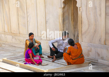 People sitting at Nagina Masjid (Gem Mosque) in Agra Fort, Uttar Pradesh, India. It was build in 1635 by Shah Jahan for the ladies of his harem and ma Stock Photo