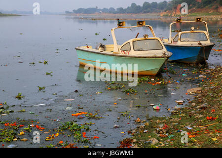 Police motorboats moored on Yamuna River near Taj Mahal in Agra, Uttar Pradesh, India. Taj Mahal was designated as a UNESCO World Heritage Site in 198 Stock Photo