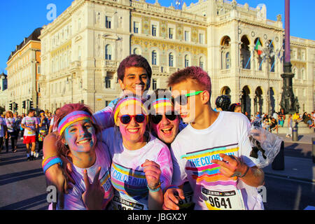 People posing for photos during The Color Run in Trieste, Italy. Trieste is the capital of the autonomous region Friuli-Venezia Giulia Stock Photo