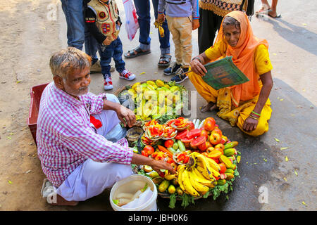 Local man selling fruit outside Jama Masjid in Fatehpur Sikri, Uttar Pradesh, India. The city was founded in 1569 by the Mughal Emperor Akbar, and ser Stock Photo