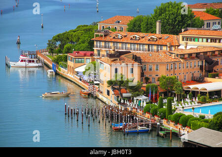 View of Giudecca Island in Venice, Italy. Venice is situated across a group of 117 small islands that are separated by canals and linked by bridges. Stock Photo