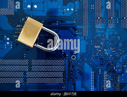 IT Security - security lock on computer circuit board  computer security concept Stock Photo