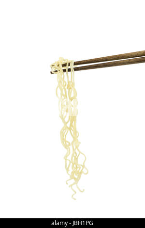 chopsticks holding oriental noodles isolated on a white background Stock Photo