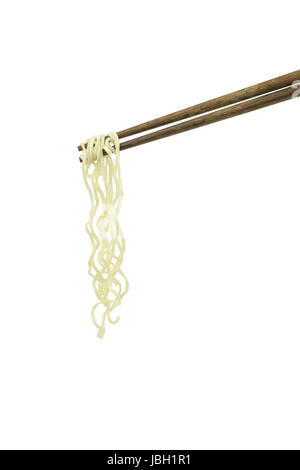 chopsticks holding oriental noodles isolated on a white background Stock Photo