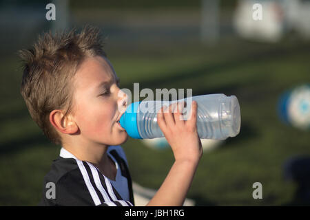 Teen boy drinking water hi-res stock photography and images - Alamy