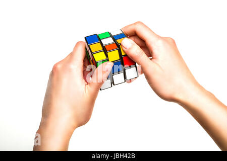 Hands holding or playing color cube game for concept solve solutions Stock Photo