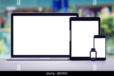 Laptop tablet pc smartphone and smartwatch mockup with white screens front view Stock Photo