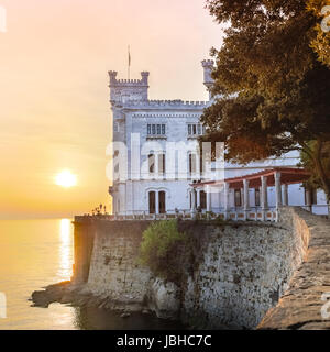 Miramare Castle, Castello di Miramare, in sunset. it is a 19th century castle on the Gulf of Trieste near Trieste, Italy. It was built for Austrian Archduke Ferdinand Maximilian. Stock Photo