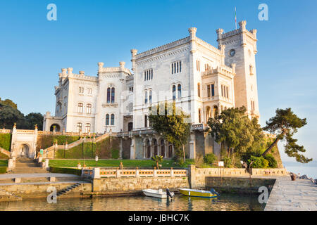 Miramare Castle, Castello di Miramare, in sunset. it is a 19th century castle on the Gulf of Trieste near Trieste, Italy. It was built for Austrian Archduke Ferdinand Maximilian. Stock Photo