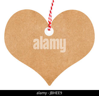Gift tag love heart shaped made from brown cardboard with string on an isolated white background Stock Photo