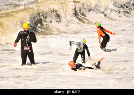 Aberystwyth Wales UK, Sunday 11 June 2017  UK Weather: A group od people in wetsuits having fun in the sea on a blustery summer sunday afternoon in Aberystwyth  on the Cardigan Bay coast of west  Wales  Photo credit: Keith Morris / ALAMY Live News
