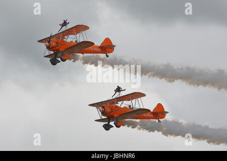 RAF Cosford, Shropshire, UK. 11th June, 2017. The Breitling Wingwalkers are always welcome with their stunts Credit: Uwe Deffner/Alamy Live News Stock Photo