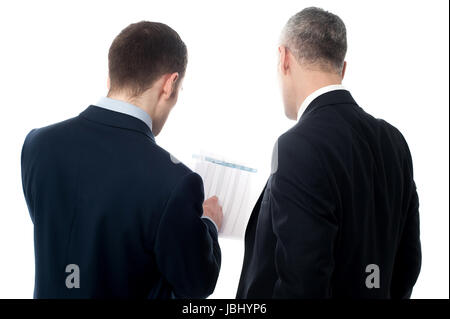 Businessmen analyzing the financial reports Stock Photo