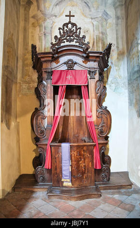 Ancient wooden carved confessional booth in Theatine Church, Munich ...