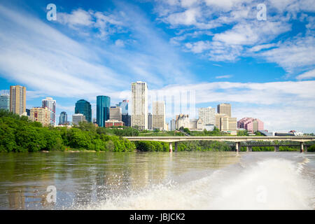 The summer skyline of the city of Edmonton, Alberta, Canada, as seen from a speedboat in the middle of the North Saskatchewan River. Stock Photo