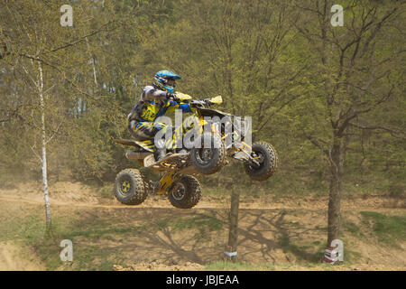 MOHELNICE,  CZECH REPUBLIC - APRIL 19: Racer is jumping a quad motorbike in the 'International Championship of the Czech Republic 2014' on April 19, 2014  in MOHELNICE, Czech Republic. Stock Photo