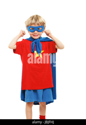 A young boy dreams of becoming a superhero. Stock Photo