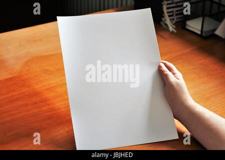 A image of a hand, or hands with paper Stock Photo