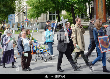 MUNICH, GERMANY – MAY 10, 2014:  Anti-Abortion Demonstration with participants carrying Christian Crosses and banners.  Hundreds protested peacefully in Munich.