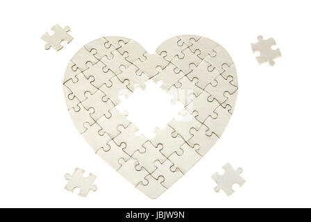 heart made from the puzzle on white Stock Photo