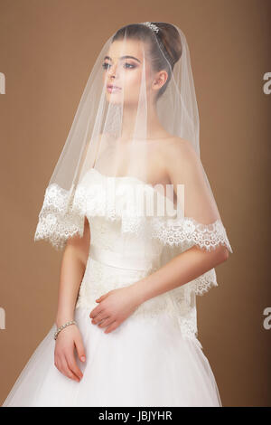 Sensuality. Woman with Transparent Wedding Veil Stock Photo