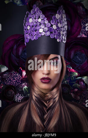 Imagination. Extravagance. Styled Woman in Fantastic Headwear Stock Photo