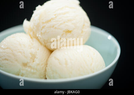 Ice Cream cup isolated over black background Stock Photo