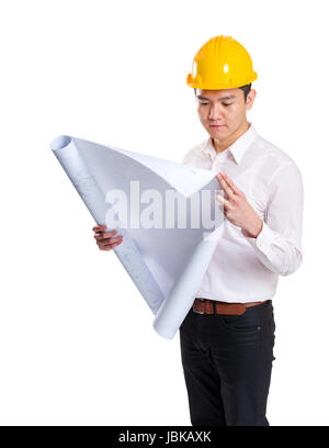 Asia construction engineer reading on blueprint Stock Photo
