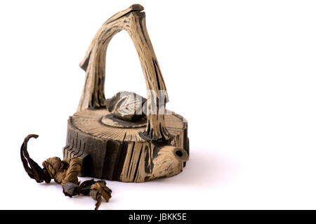 A close up view of Chinese ceramic teapot over white Stock Photo