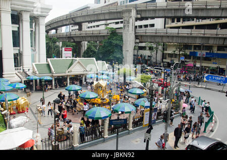View of Erawan Shrine and people praying Thao Maha Phrom or Lord Brahma at Ratchaprasong intersection of Ratchadamri Road in Pathum Wan on May 16, 201 Stock Photo