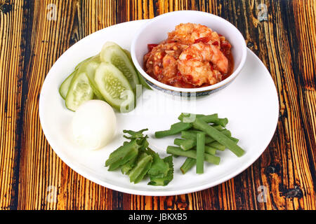 Thai Popular cuisine, Fresh shrimp chili dip as Nam Prik Kung Sod  in Thai and boiled egg,green bean ,winged bean and cucumber. Stock Photo