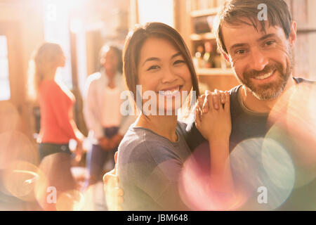 Portrait smiling couple hugging Stock Photo