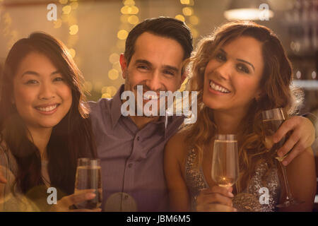 Portrait smiling friends drinking champagne Stock Photo