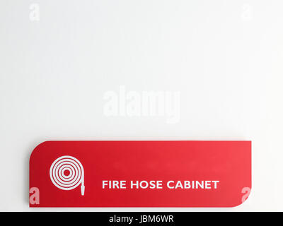 Fire hose cabinet label on the white wall of the new building, Copy space. Stock Photo