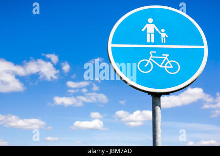 Bicycle and pedestrian shared route sign on the sky background Stock Photo