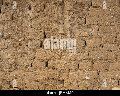 Old brick wall with tiny stones background Stock Photo