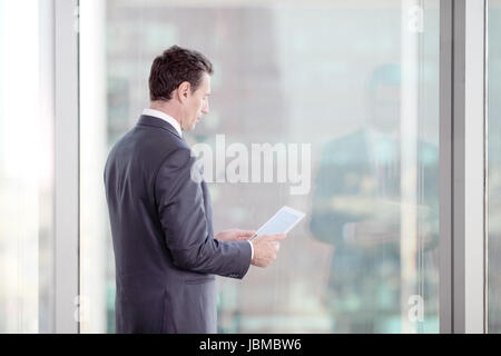 Businessman working with tablet and touching digital display Stock Photo