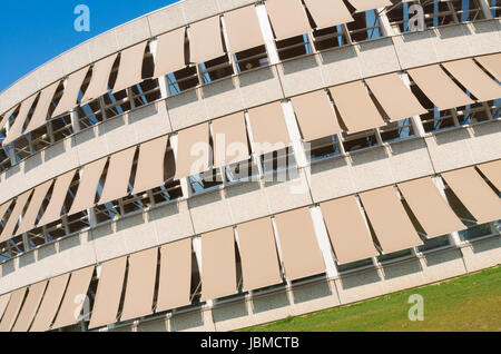 modern building with closed sunshades on a sunny day Stock Photo