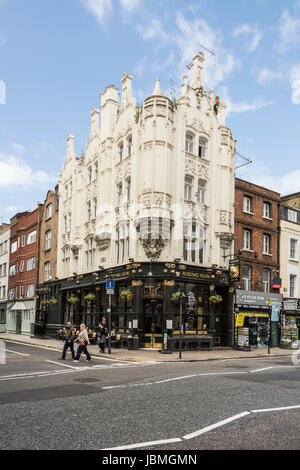 The Rising Sun public house on Tottenham Court Road, Fitzrovia, London, UK Stock Photo