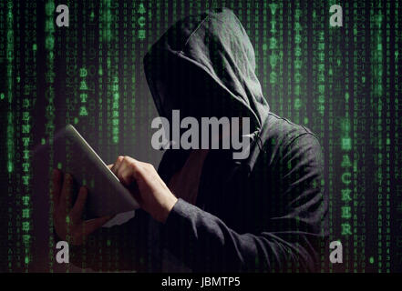 Computer hacker with digital tablet stealing data concept for network security or ransomware Stock Photo