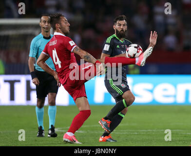 Serbia's Nemanja Gudelj (left) and Wales' Joe Ledley battle for the ball during the 2018 FIFA World Cup Qualifying, Group D match at the Rajko Mitic Stadium, Belgrade. PRESS ASSOCIATION Photo. Picture date: Sunday June 11, 2017. See PA story SOCCER Serbia. Photo credit should read: Simon Cooper/PA Wire. RESTRICTIONS: Editorial use only, No commercial use without prior permission. Stock Photo