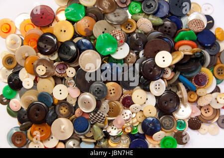 Colorful sewing buttons on white background. Close up Stock Photo