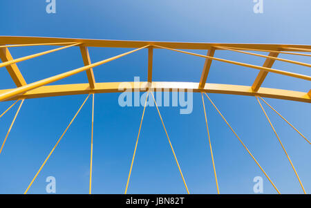 detail of the yellow arch bridge in Utrecht, netherlands. The Hogeweide Bridge is a steel arch bridge over the Amsterdam-Rhine Canal Stock Photo