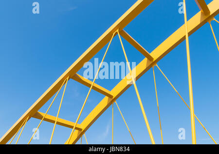 detail of the yellow arch bridge in Utrecht, netherlands. The Hogeweide Bridge is a steel arch bridge over the Amsterdam-Rhine Canal Stock Photo