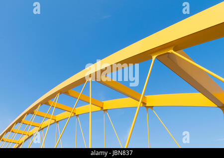 detail of the yellow arch bridge in Utrecht, netherlands. The Hogeweide Bridge is a steel arch bridge over the Amsterdam-Rhine Canal Stock Photo